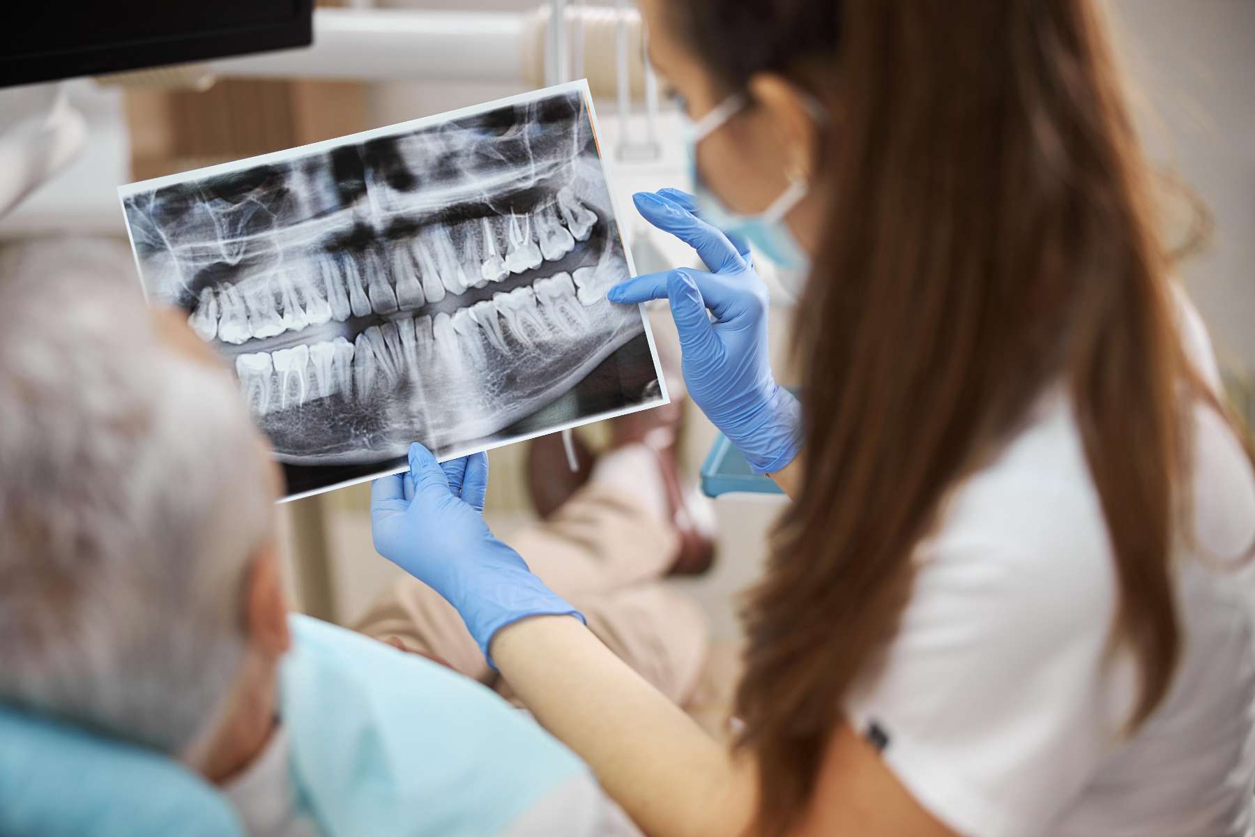 Dentist in Troy showing the dental xray of his patient