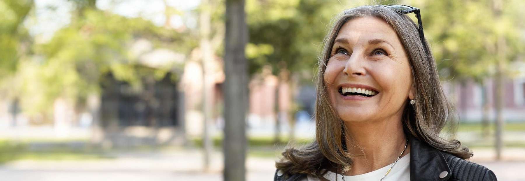 Portrait of woman with a flawless dental implant